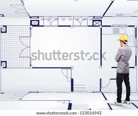 Engineering Person Standing Near A House Blueprints
