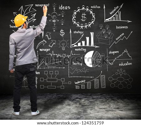 engineer drawing business plan concept idea on wall blackboard background