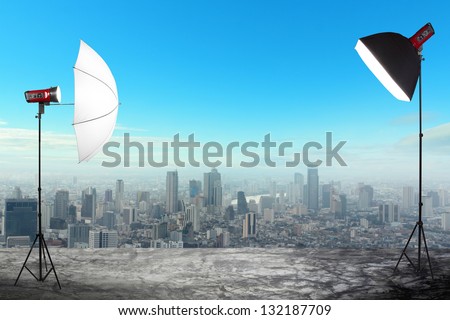 photography studio with a light set up on city buildings backdrop, Space for text or image