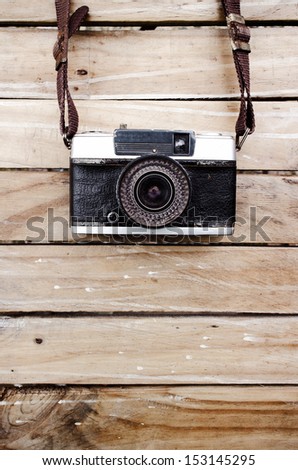 Old camera and on wooden table, Space for text or image for design work