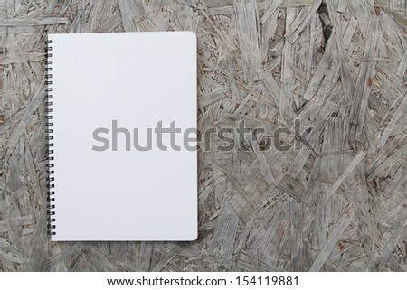 Notebook paper on wood background