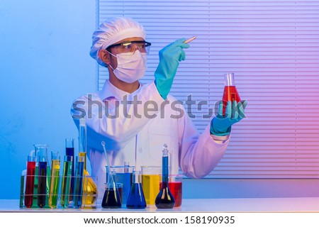 Man scientist holding a test tube with liquid, With holding pen drawing for design work