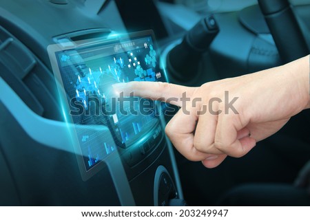 Pushing on car screen interface, With driver entering an address into the navigation system