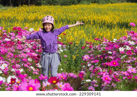 Little asian girl in flower fields