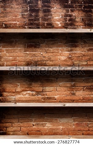Wood shelf on brick background