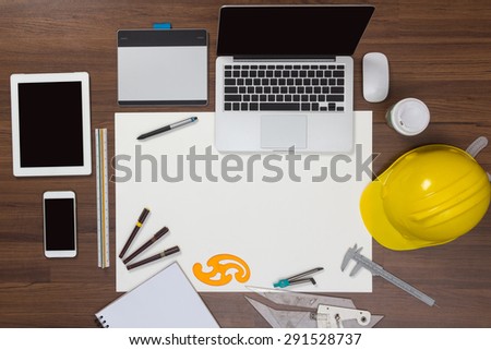 Office desk background with construction project ideas concept, With laptop computer, drawing equipment and cup of coffee. View from above with copy space
