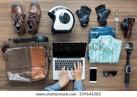Freelancer needs mock up on wooden table in home interior, laptop computer, hipster clothes and accessories electronic business and distance work concept, View from above top view with copy workspace