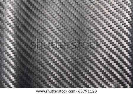 Black Carbon fiber texture closeup as background