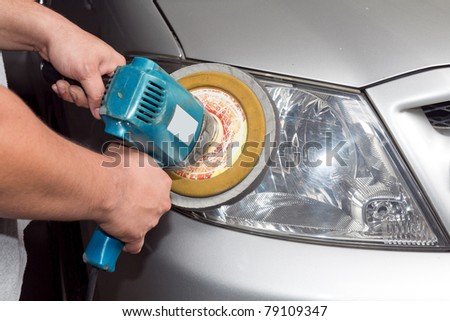 Car headlights with power buffer machine at service station - a series of CAR CARE images.
