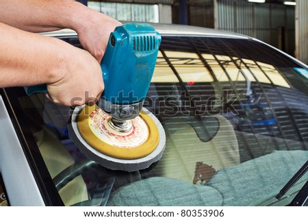 Car Glass polishing  with power buffer machine. CAR CARE images. closeup Useful as background for design-works.