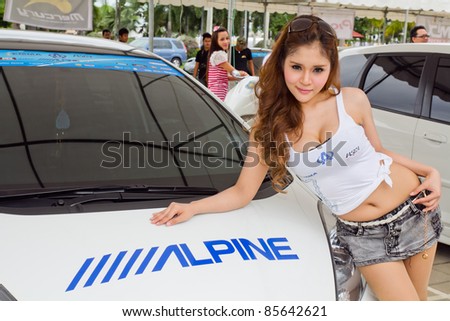 PATTAYA CHONBURI, THAILAND - SEPTEMBER 24: unidentified Promo Girls with Modified Cars in Honda jazz model car at the Car Audio show on September 24, 2011 in Pattaya Chonburi City, Thailand.