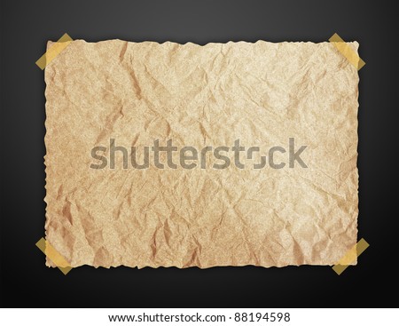 Old Brown paper and sticky tape on blackboard