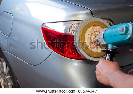 Car tail light with power buffer machine at service station - a series of CAR CARE images.