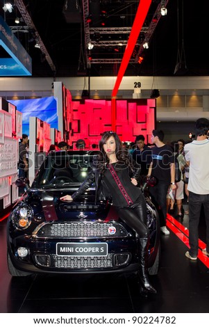 BANGKOK - DECEMBER 4: Female presenters model at the Mini cooper S booth at the 28th Thailand International Motor Expo on December 4, 2011 in Bangkok, Thailand.