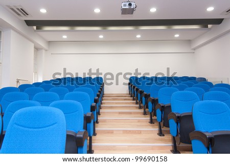 Conference room - typical empty conference room with chairs and LCD projector