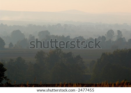 Foggy Mountains - Foggy day reveals color stacks of trees, land and mountains - colors muted due to fog