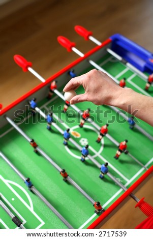 Football about to be dropped to start the game of table football