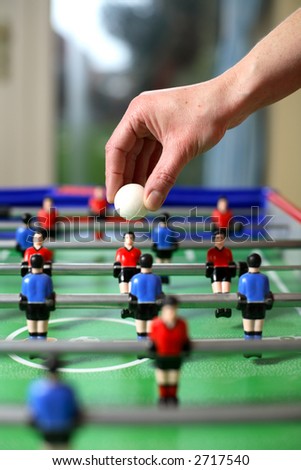 Football about to be dropped to start the game of table football