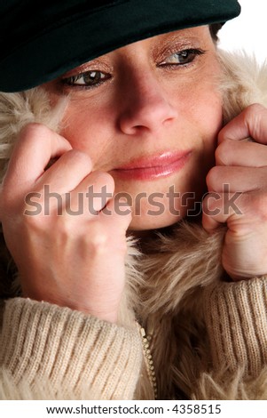 Young woman pulling her collar up to keep warm
