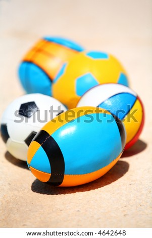 Five various shaped balls on the floor