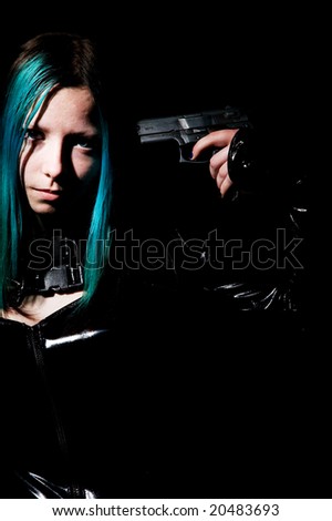 Gothic girl pointing a gun at her head