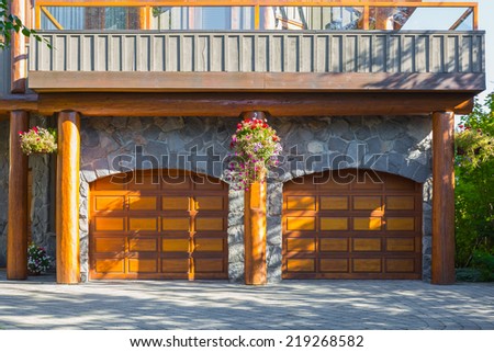 Double door garage in a modern log house in Canada