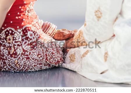 Indian bride and groom holding hands after the wedding ceremony
