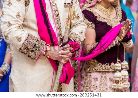Indian bride and groom in a temple during the wedding ceremony.