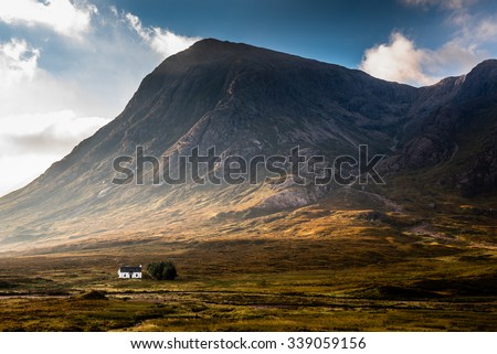 Isolated house surrounded by mountains in the Scottish Highlands