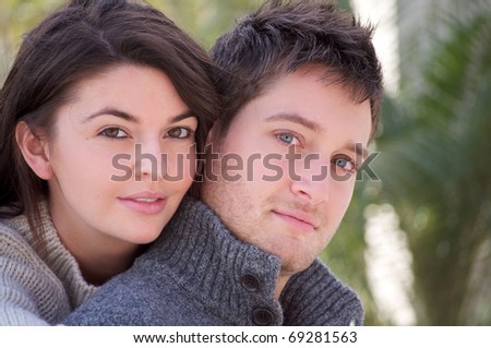 Young attractive white couple embracing each other