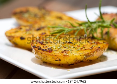 Sweet fresh potatoes oven roasted with garlic