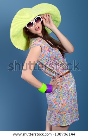 Shot of a beautiful girl in summer style posing at studio.