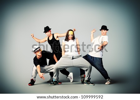 Group of modern dancers dancing hip-hop at studio.