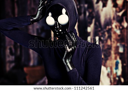 Scary alien creature in an abandoned house. Halloween, horror.