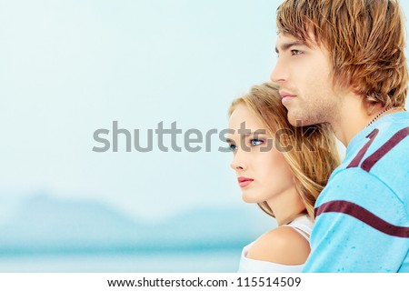 Portrait of a young people in love looking dreamily into the distance.