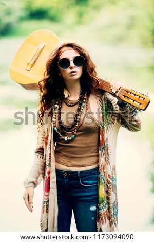 Beautiful hippie girl posing outdoor. Contemporary bohemian style. Spirit of freedom. Fashion shot. Bohemian, bo-ho style.