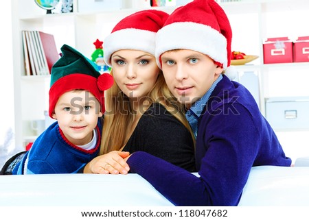 Portrait of a happy family spending Christmas time at home.