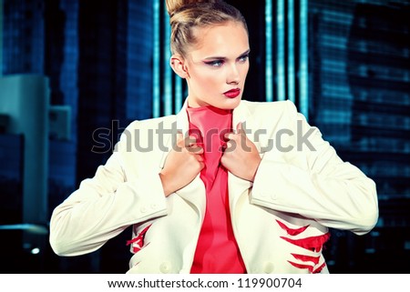 Portrait of a fashion model posing over big city background.