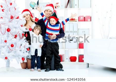 Portrait of a happy family spending Christmas time at home.