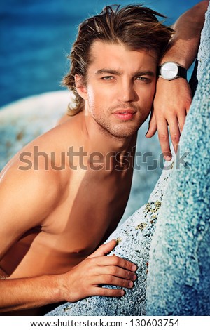 Portrait Of A Handsome Male Model Posing At The Seaside.