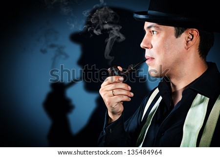 The man smoking tobacco pipe
