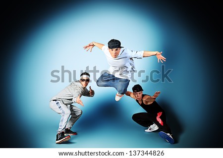 Group of modern dancers dancing hip-hop at studio.