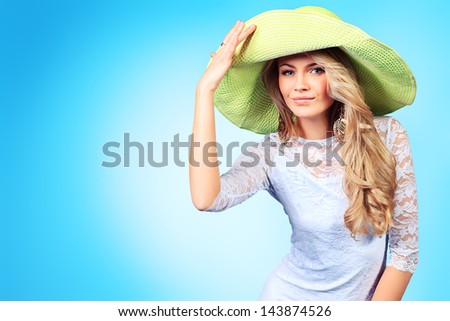 Portrait of a pretty smiling young woman in summer clothes.