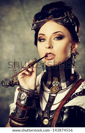 Portrait of a beautiful steampunk woman over grunge background Portrait of a beautiful steampunk woman over grunge background