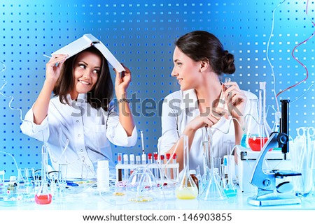 Laboratory staff in the working process. Laboratory equipment.