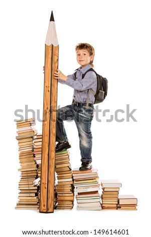 A boy climbing the stairs of books with a huge pencil. Education. Isolated over white.