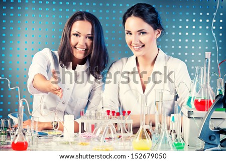 Laboratory staff, demonstrating a willingness to cooperate. Laboratory equipment.