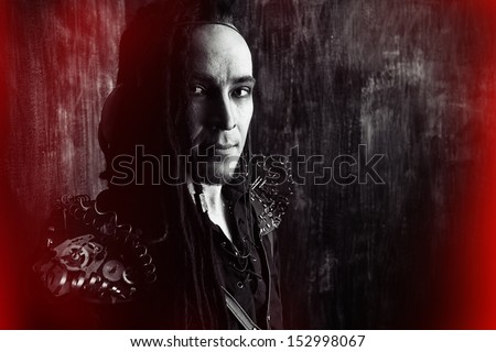 Portrait of a steampunk man over grunge background.