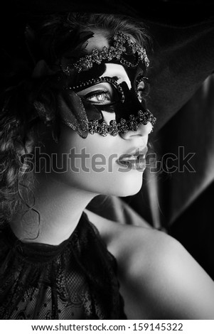 Beautiful elegant woman in carnival mask.