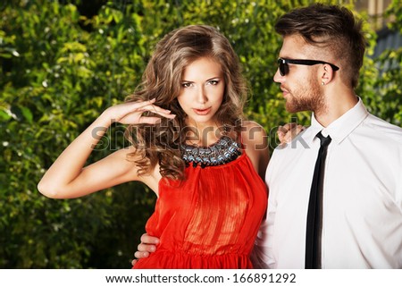 Beautiful Fashionable Couple Standing Outdoor.